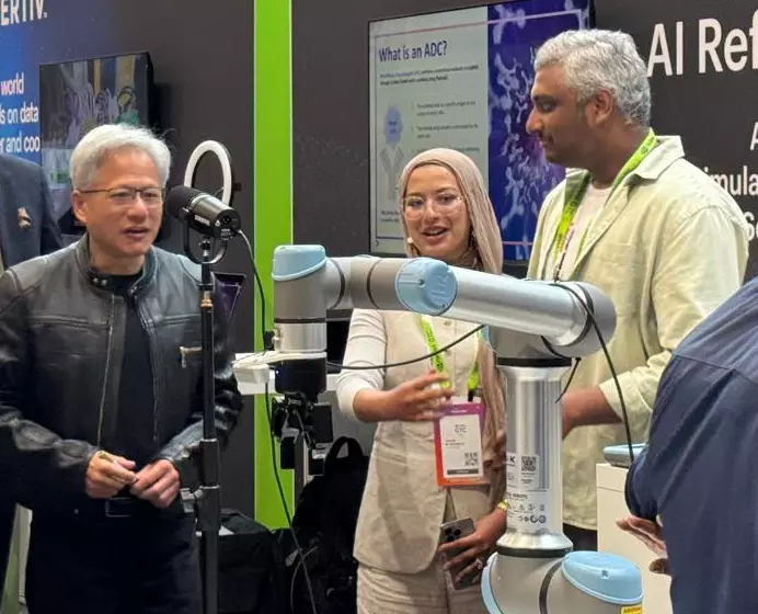 Jensen Huang at our booth. I'm on the right.
